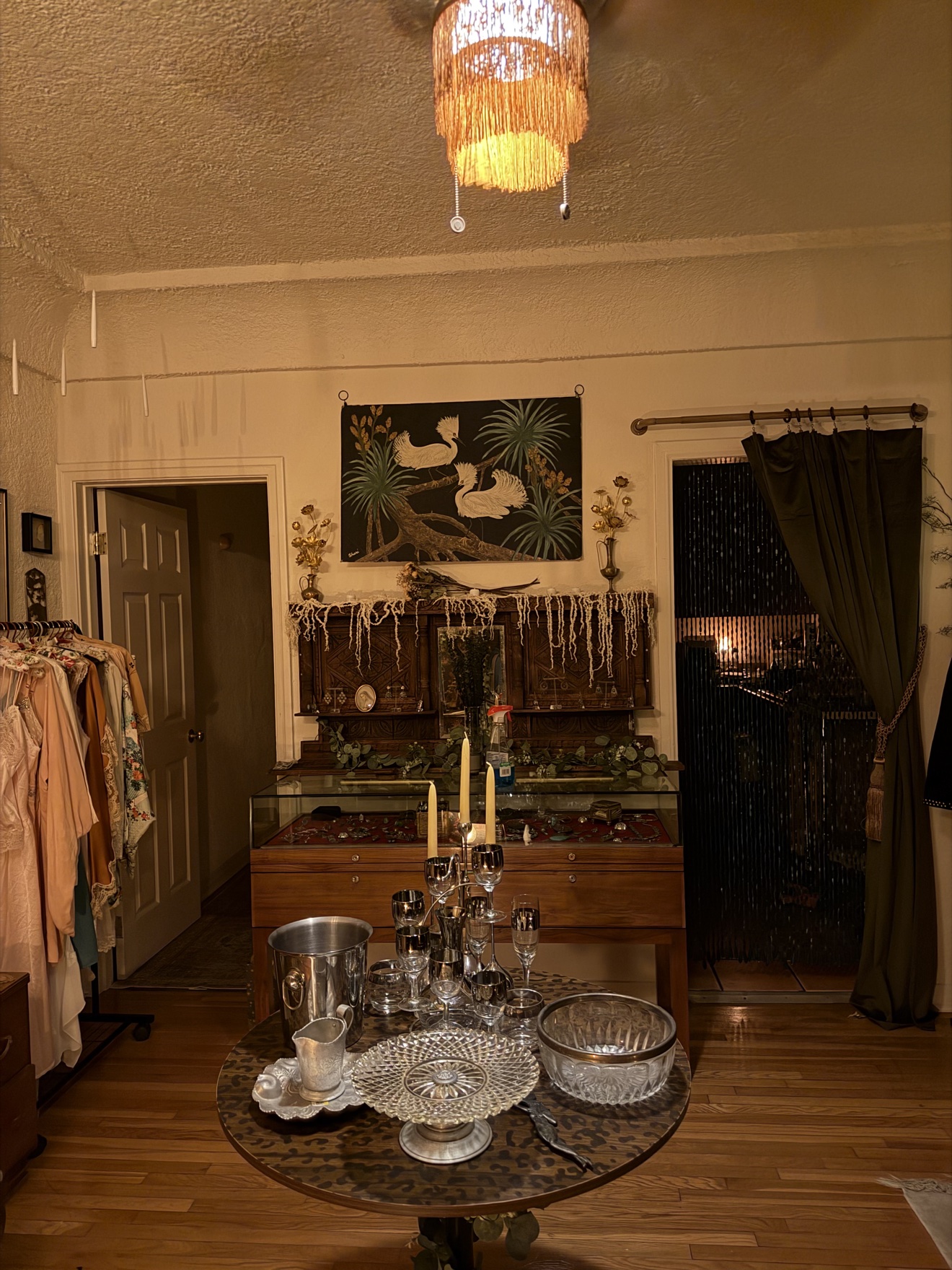 A carved jewelry cabinet with antique silver and crystal at The Last Light